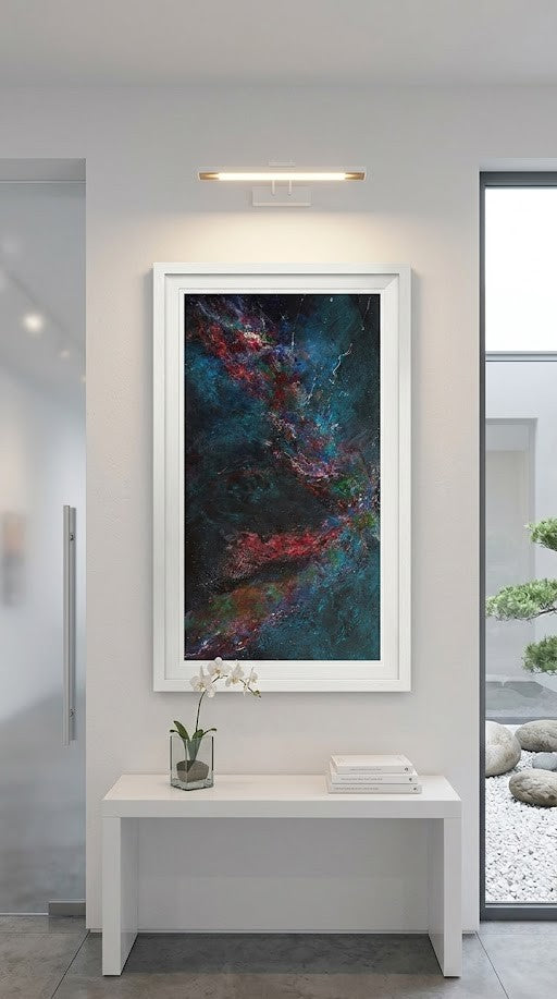 Framed space-themed artwork on a wall in a modern interior setting.